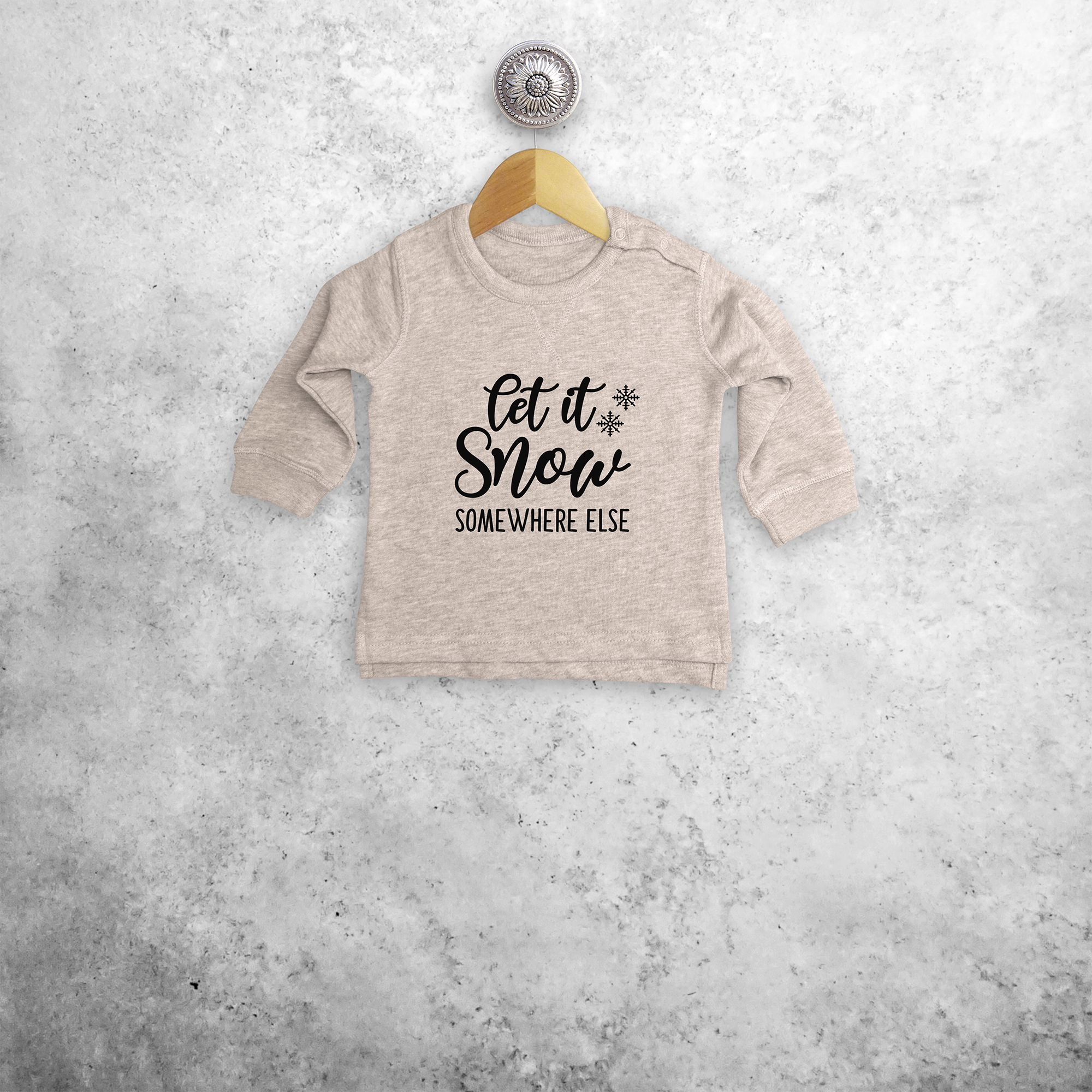 'Let it snow - somewhere else' baby sweater
