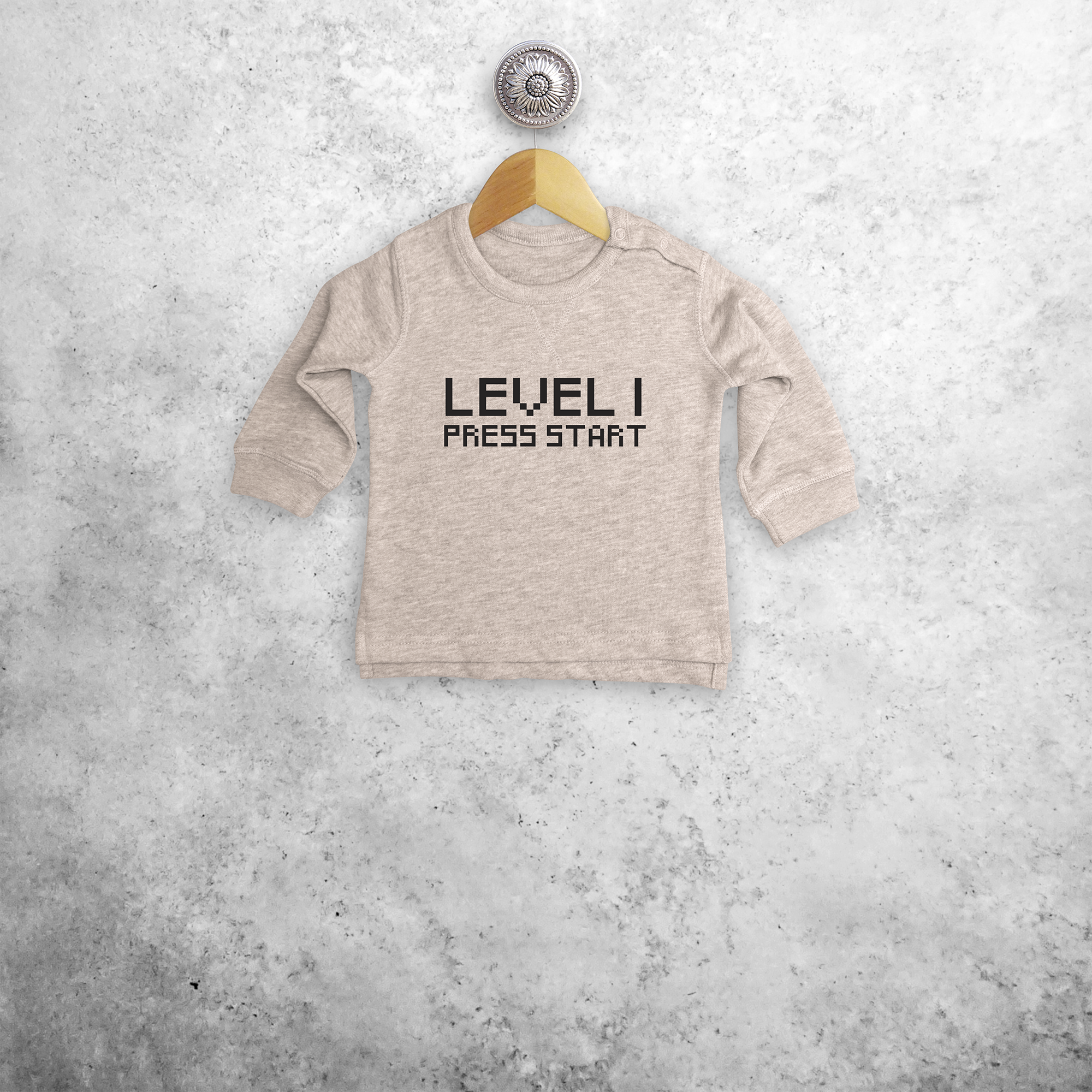 'Level... - Press start' baby sweater