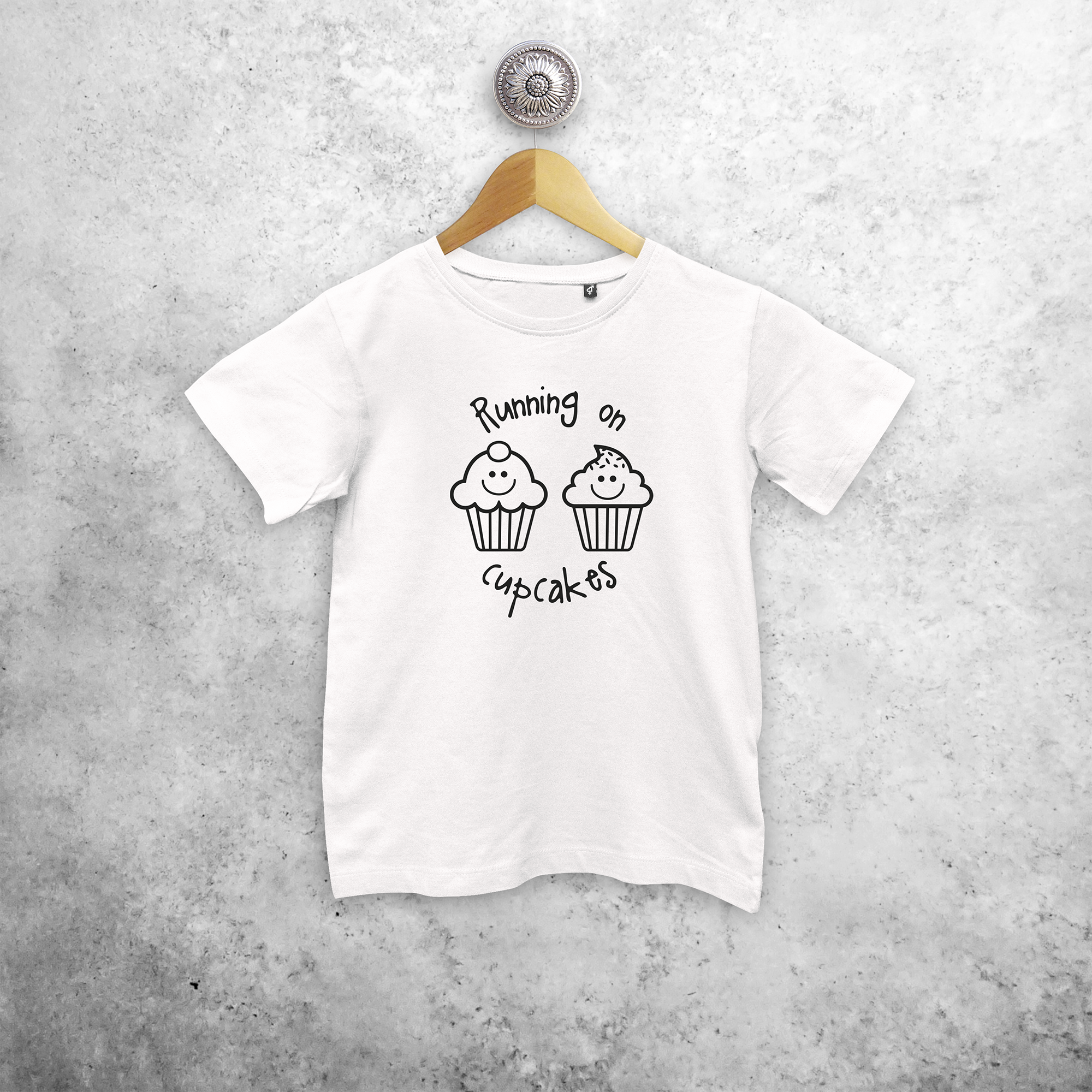 'Running on cupcakes' kids shortsleeve shirt