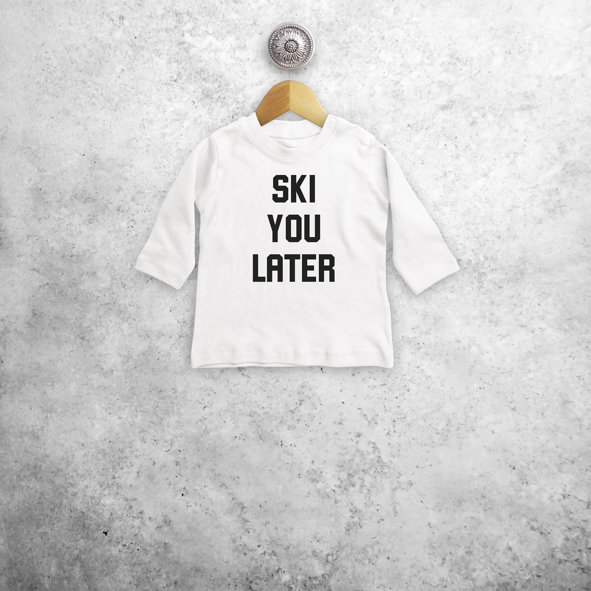 Baby or toddler shirt with long sleeves, with ‘Ski you later’ print by KMLeon.