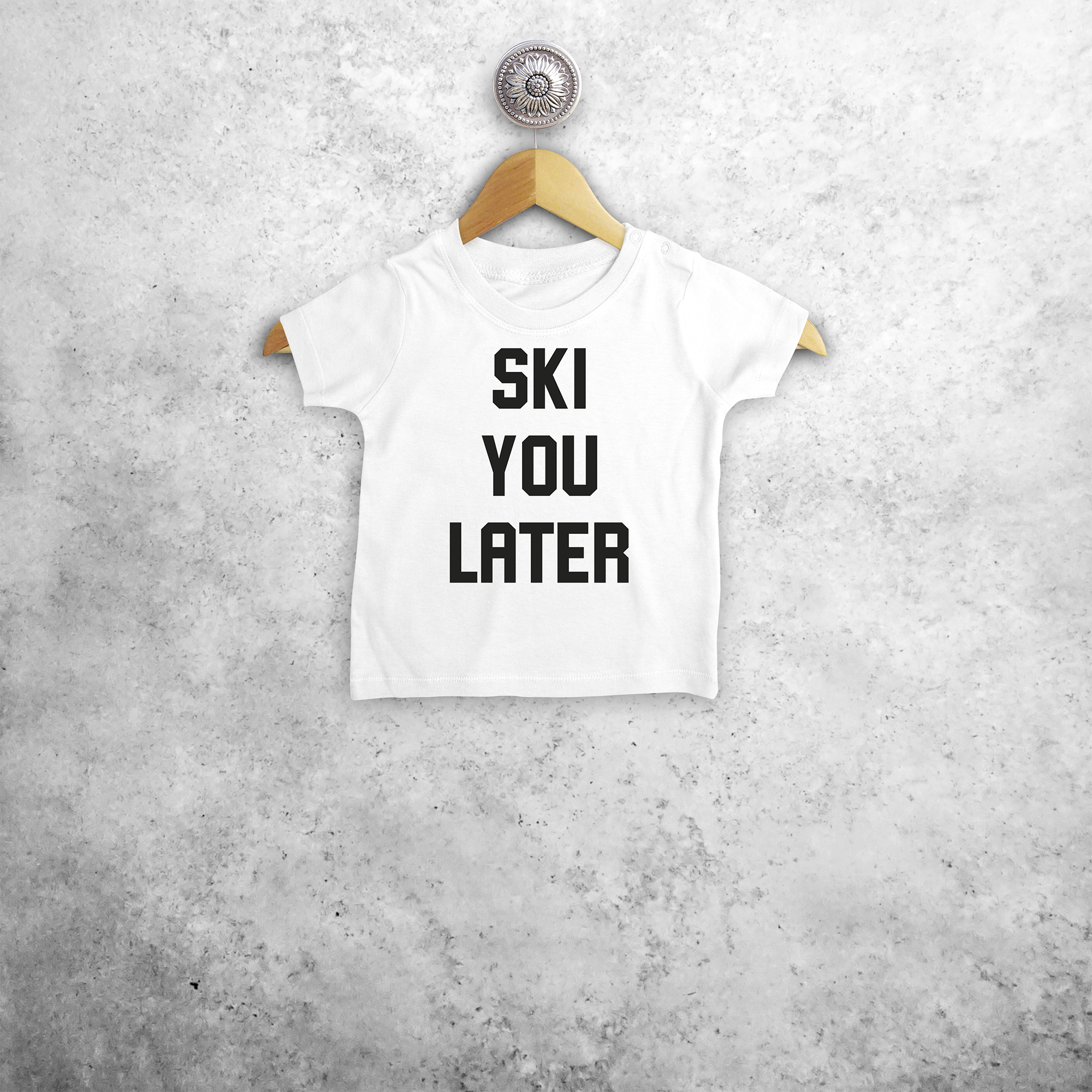 Baby or toddler shirt with short sleeves, with ‘Ski you later’ print by KMLeon.
