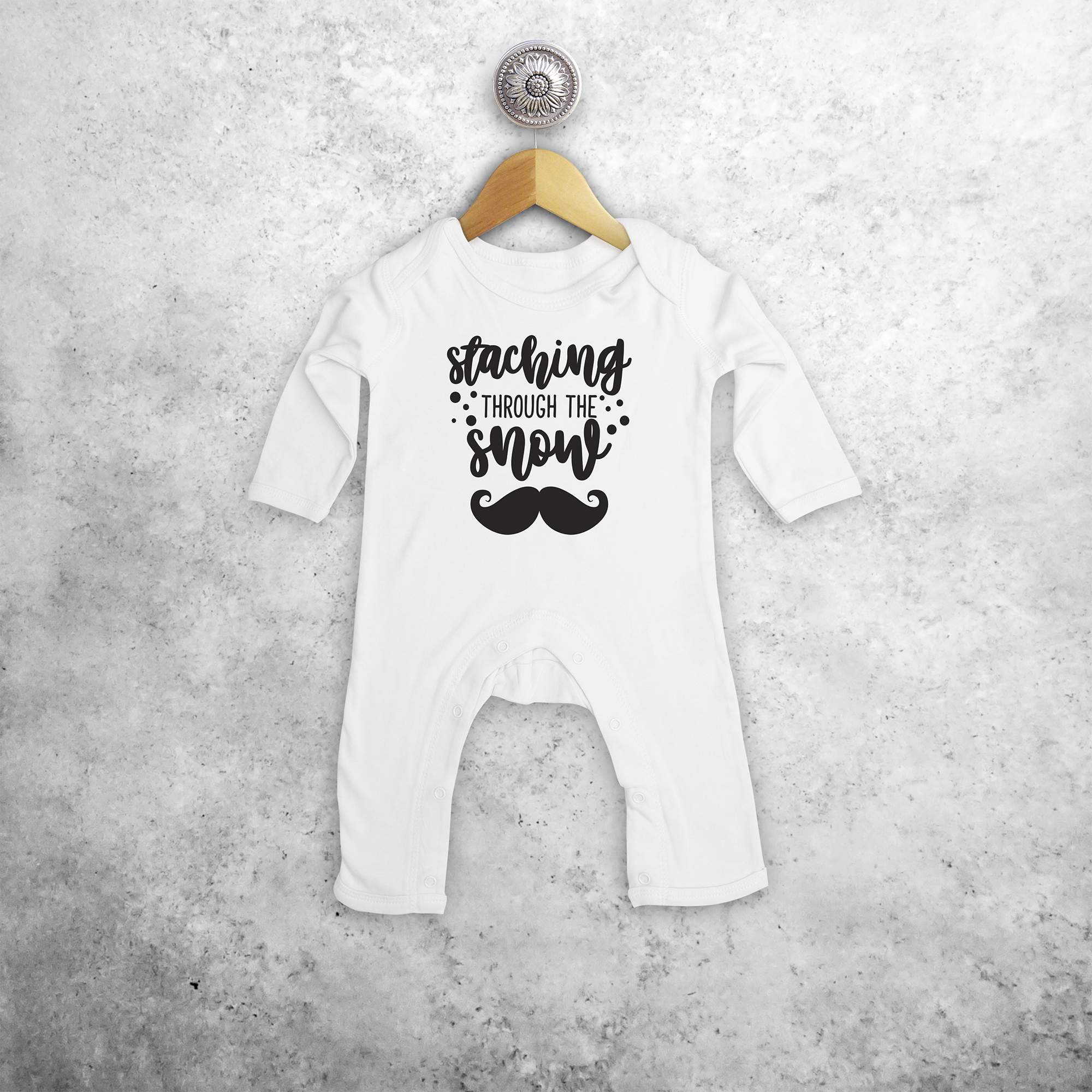 Baby or toddler romper with long sleeves, with ‘Staching through the snow’ print by KMLeon.