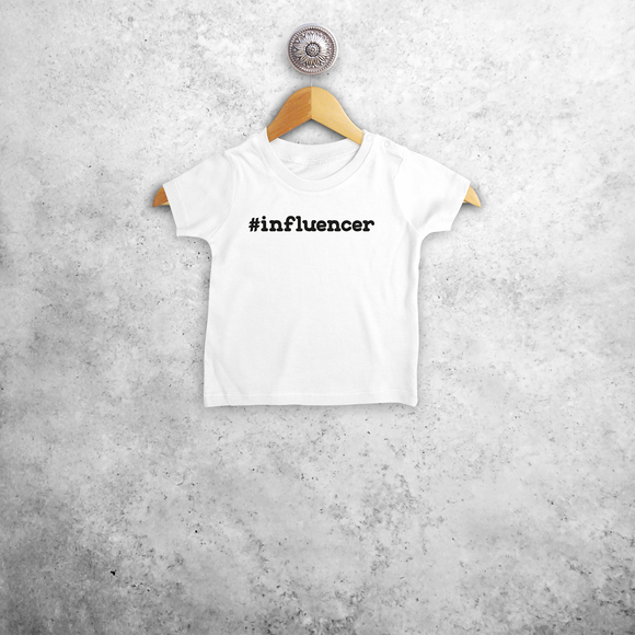 Baby or toddler shirt with short sleeves, with '#influencer' print by KMLeon.